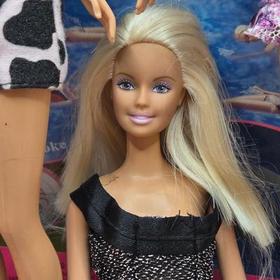 LOT 70: "Girls Just Wanna have Fun" Assortment of Barbies and Their Shoes...