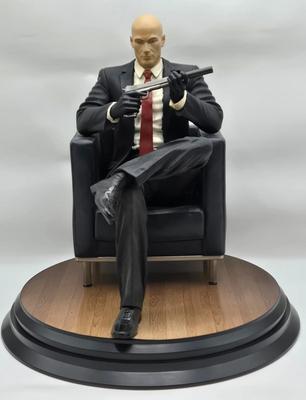 LOT 75: Hitman Agent 47 Statue, FarCry 4 Pagan Figurine, Max Payne 3 Statue, and Hitman 2 Accessories in Box