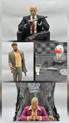 LOT 75: Hitman Agent 47 Statue, FarCry 4 Pagan Figurine, Max Payne 3 Statue, and Hitman 2 Accessories in Box