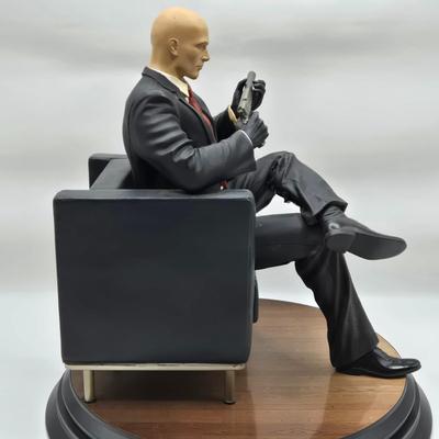 LOT 75: Hitman Agent 47 Statue, FarCry 4 Pagan Figurine, Max Payne 3 Statue, and Hitman 2 Accessories in Box