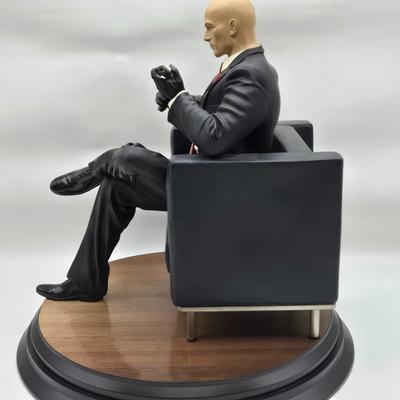 LOT 75: Hitman Agent 47 Statue, FarCry 4 Pagan Figurine, Max Payne 3 Statue, and Hitman 2 Accessories in Box