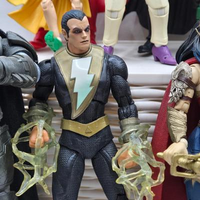 LOT 80: Large Variety of Action Figures Including Superman, Robin, Green Lantern, Many Anti-Heroes, and More