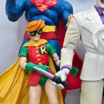 LOT 80: Large Variety of Action Figures Including Superman, Robin, Green Lantern, Many Anti-Heroes, and More