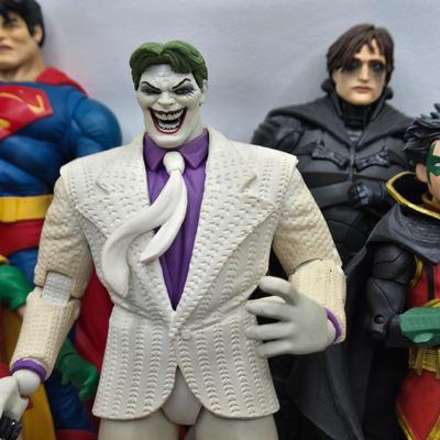 LOT 80: Large Variety of Action Figures Including Superman, Robin, Green Lantern, Many Anti-Heroes, and More