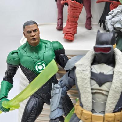 LOT 80: Large Variety of Action Figures Including Superman, Robin, Green Lantern, Many Anti-Heroes, and More