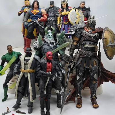 LOT 80: Large Variety of Action Figures Including Superman, Robin, Green Lantern, Many Anti-Heroes, and More