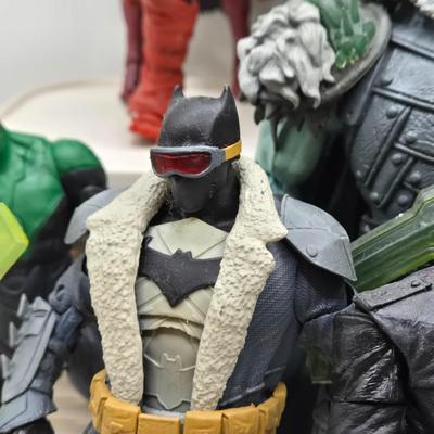 LOT 80: Large Variety of Action Figures Including Superman, Robin, Green Lantern, Many Anti-Heroes, and More