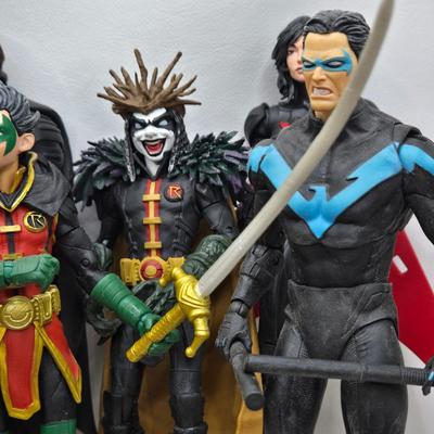 LOT 80: Large Variety of Action Figures Including Superman, Robin, Green Lantern, Many Anti-Heroes, and More