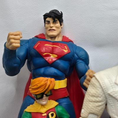 LOT 80: Large Variety of Action Figures Including Superman, Robin, Green Lantern, Many Anti-Heroes, and More