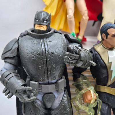 LOT 80: Large Variety of Action Figures Including Superman, Robin, Green Lantern, Many Anti-Heroes, and More
