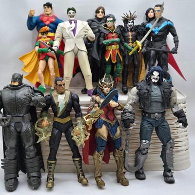 LOT 80: Large Variety of Action Figures Including Superman, Robin, Green Lantern, Many Anti-Heroes, and More