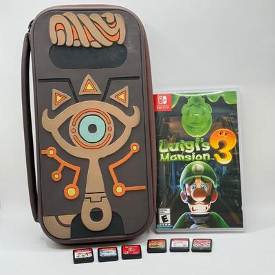 LOT 82: Legend of Zelda Nintendo Switch Case, Luigi's Mansion 3 w/ Case & More Nintendo Switch Games: Breath of the Wild, Super...