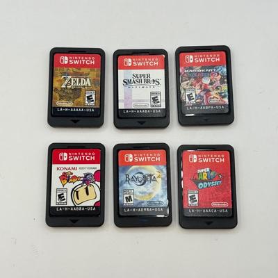 LOT 82: Legend of Zelda Nintendo Switch Case, Luigi's Mansion 3 w/ Case & More Nintendo Switch Games: Breath of the Wild, Super...