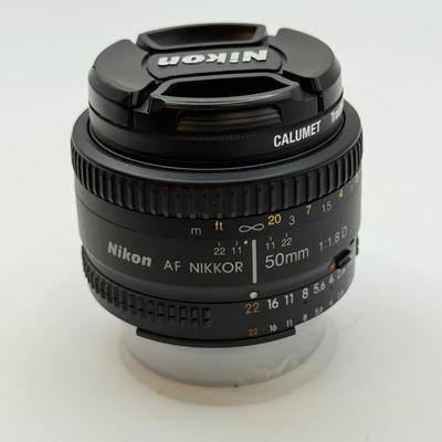 LOT 83: Nikon AF Nikkor 50mm 1:1.8 D f/1.8 Prime Lens w/ 52mm Calumet Traditional UV Filter & Nikon Speedlight SB-600 External Flash