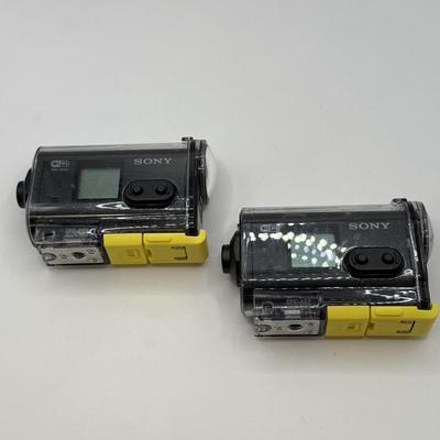 LOT 92: 2 Yi 4k Action Cameras Model YAS.1616.INT, 2 Sony Exmor R SteadyShot HDR-AS20 Cameras w/ Case & 2 Mini Manfrotto Tripods