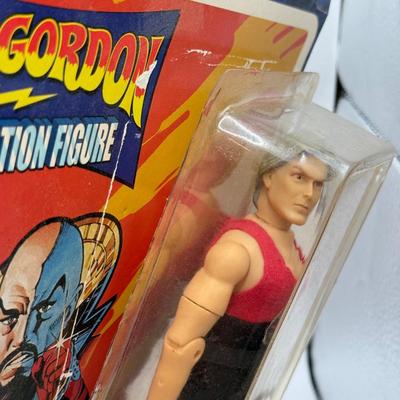 LOT 93: Flash Gordon Classic Action Figure, Gritty Chia Pet, Pop! Jessica Rabbit Giant Enamel Pin, Robotech VF-11 & More