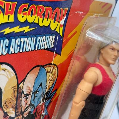 LOT 93: Flash Gordon Classic Action Figure, Gritty Chia Pet, Pop! Jessica Rabbit Giant Enamel Pin, Robotech VF-11 & More