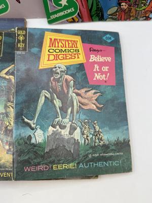 LOT 177: Strange & Mysterious Books: Mystery Comics Digest, UFO Magazines, A Christmas Carol & Dracula