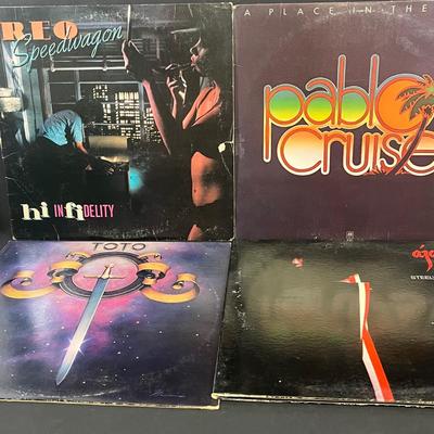 LOT 193: Vintage Vinyl Records - Rod Stewart, REO Speedwagon, Toto and More