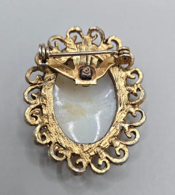 LOT 212J: Gucci Mirror Compact, DKNY Key Holder, and Cameo Brooch