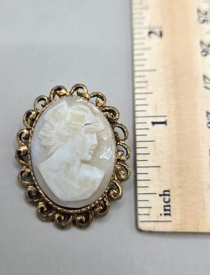 LOT 212J: Gucci Mirror Compact, DKNY Key Holder, and Cameo Brooch