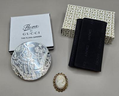 LOT 212J: Gucci Mirror Compact, DKNY Key Holder, and Cameo Brooch