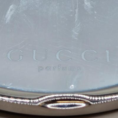 LOT 212J: Gucci Mirror Compact, DKNY Key Holder, and Cameo Brooch