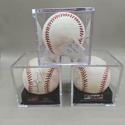 LOT 218: Tim Byrdak, John Parrish, and Mike DeJean Signed Baseballs/ No COA