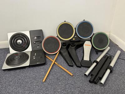 LOT 230: DJ Hero Turntables, XBOX Rockband Drum Kit & Variety of Video Games
