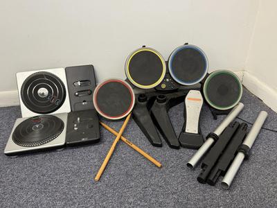LOT 230: DJ Hero Turntables, XBOX Rockband Drum Kit & Variety of Video Games