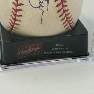 LOT 233: Rawlings Baseball in Display Case signed by Jim Palmer