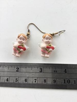 Unmarked angel fashions earrings