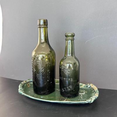 Two Vintage Bottles on Ceramic Platter