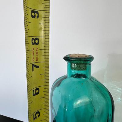 Turquoise glass bottle with cork