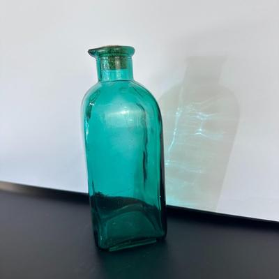 Turquoise glass bottle with cork