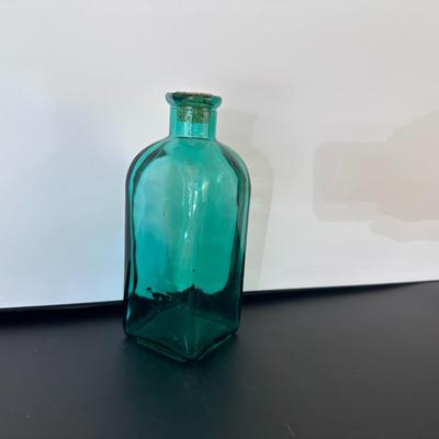 Turquoise glass bottle with cork