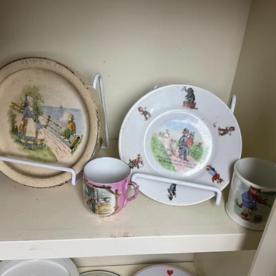 UBC1515 Two Shelves of Antique Baby Plates