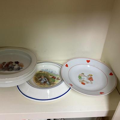 UBC1515 Two Shelves of Antique Baby Plates