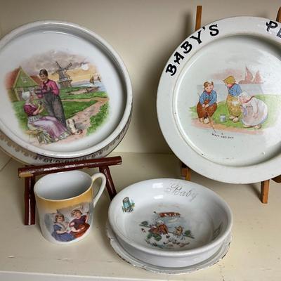 UBC1515 Two Shelves of Antique Baby Plates