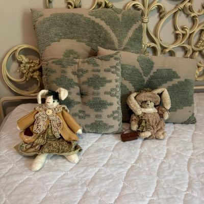 Three Pillows and Two Dolls