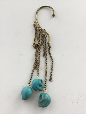 Gold tone blue skull dangle over ear jewelry