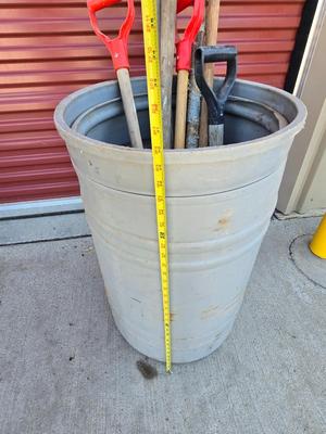 Large Barrel of Mixed Farm Tools and handles