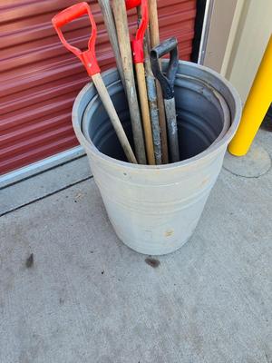 Large Barrel of Mixed Farm Tools and handles