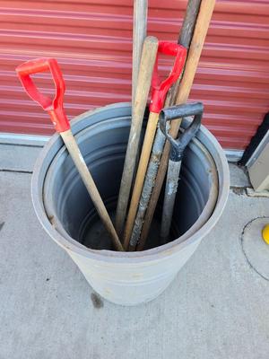 Large Barrel of Mixed Farm Tools and handles