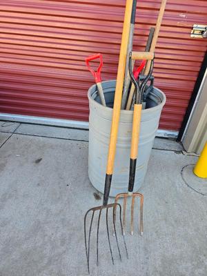 Large Barrel of Mixed Farm Tools and handles