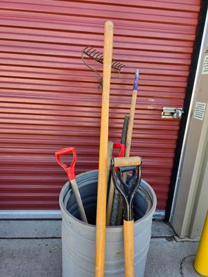 Large Barrel of Mixed Farm Tools and handles