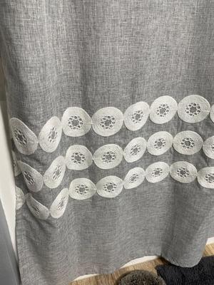Gray shower curtain and three rugs