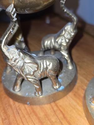 Brass Figurines. Elephants holding globes