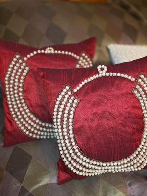 Pair of Red Throw Pillows with pearl beading.
