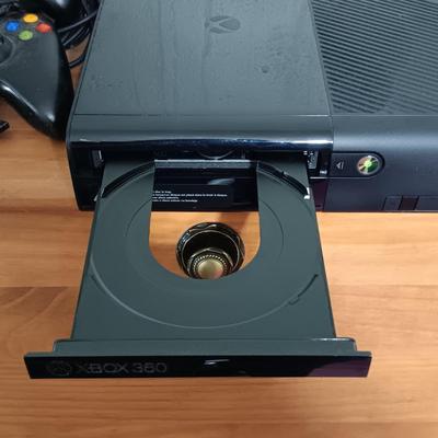 LOT 11: XBox 360 E Console with Controllers & More